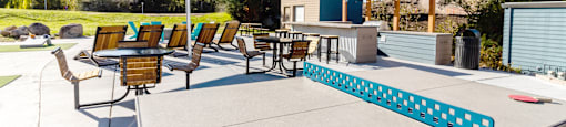 large patio with tables and chairs and a ping pong table