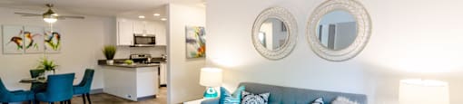 a living room with a blue couch and a coffee table