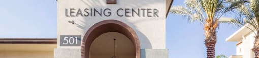 A leasing center with bicycles parked in front.