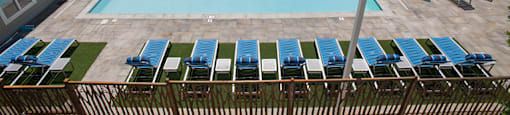 Sparkling pool with sun deck at Marina Village Apartments, NV 89434