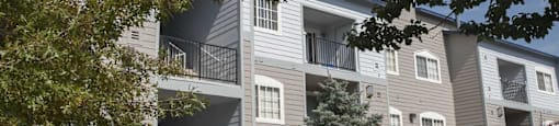 Building exterior with foliage at Marina Village Apartments, Sparks 89434