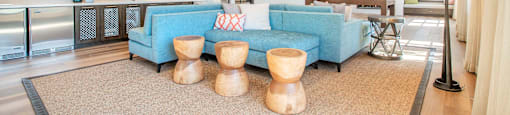 resident social lounge with a blue couch and tables