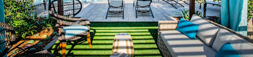 a swimming pool with lounge chairs
