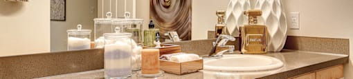 Designer Granite Countertops in all Bathrooms, at Newberry Square Apartments, 16116 Ash Way