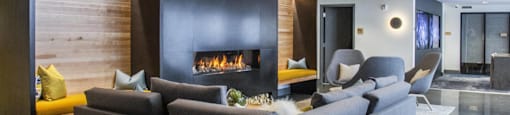a living room with a couch and a fireplace