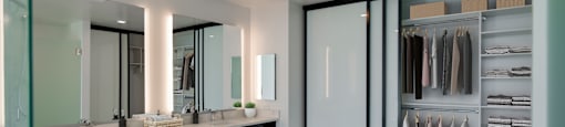 a large bathroom with a large closet and two sinks