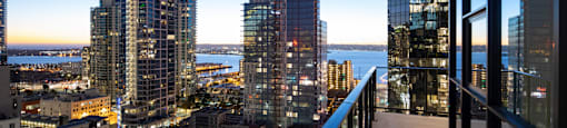 a balcony with a view of San Diego at night