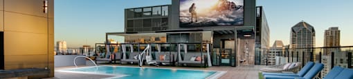 rooftop resort style pool with TV at Luma