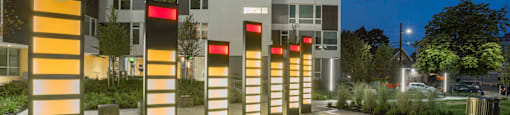 illuminated columns in front of Twenty20 Mad Apartments