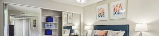 a bedroom with a bed and a ceiling fan