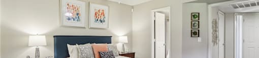 a bedroom with a bed and a ceiling fan