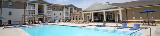 An image of Peachtree Village’s upscale apartments in Boiling Springs, SC. The resort-style pool is visible in the foreground.