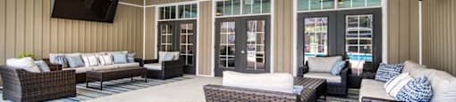 The poolside lounge at Peachtree Village. This large and comfortable communal space is a great place to meet neighbors and make friends.