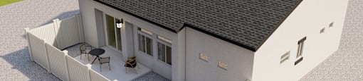 A white house with a black roof and a white fence.