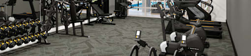 A spacious gym with a variety of exercise equipment.
