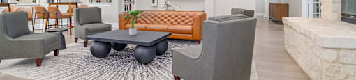 A living room with a grey sofa and a coffee table.