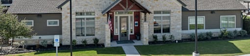 A house with a flag on the front porch.