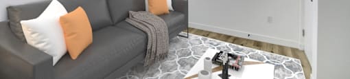 A living room with a grey couch and a painting on the wall.