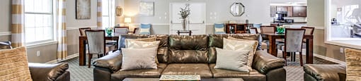 Clubhouse with comfortable seating and entertainment space Chelsea Village Apartments.