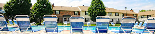 Outdoor Swimming Pool with Seating at Chelsea Village Apartments
