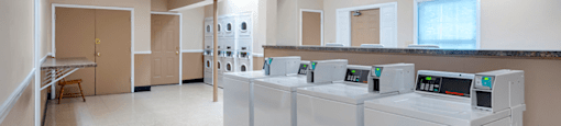 Apartment laundry facility at Mount Vernon with washers, dryers, and a clean, organized space for doing laundry.