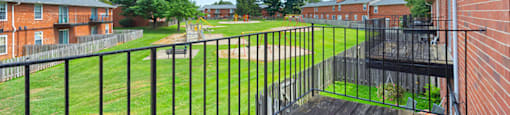 Balcony of a 1-bed, 1-bath apartment in Mount Vernon, featuring a railing and space for outdoor seating with views of the surrounding area.