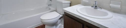 Bathroom with a tub, vanity and a mirror, in a 1-bed, 1-bath apartment at Mount Vernon.