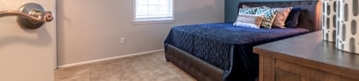 Bedroom at Ashton Brook Apartments with a large window