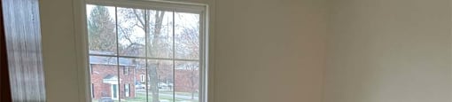 Bedroom at Carriage House West with Large Windows.