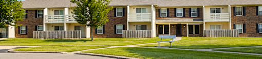 Building exterior of Fairington Apartments in Anderson, featuring windows, balconies and patios.