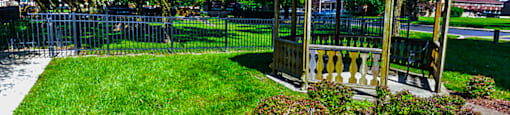 Gazebo at Carriage House Evansville, surrounded by greenery.