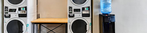 Laundry facility at Ashton Brook Apartments, featuring washers and dryers.