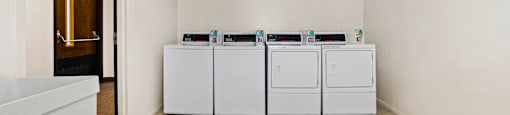 Laundry facility at Fairington Apartments in Anderson, featuring washers and dryers.