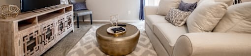 Living Room with a sliding door to the patio/balcony at Chelsea Village Apartments