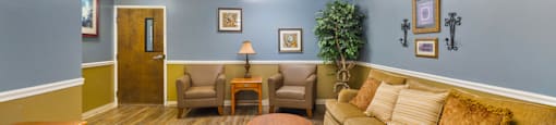Lobby with comfortable seating in the senior building at Northwood Apartments in Franklin.