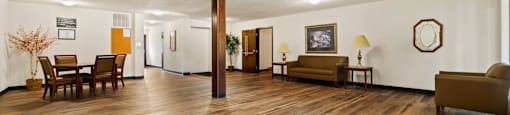Social lobby at Fairington Apartments in Anderson, featuring seating and a welcoming atmosphere.