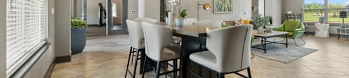 an open living room and dining room with a large table and chairs