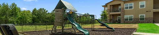 the preserve at ballantyne commons playground with slides and a swing set