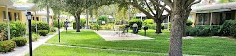 beautifully landscaped grounds with street lamps