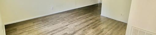 living room with hardwood-inspired flooring