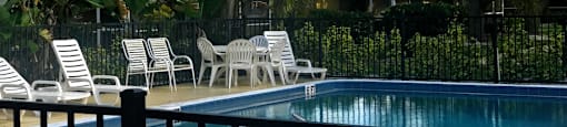 stunning pool and sundeck with furnishings