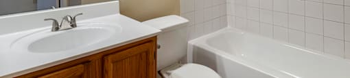 a bathroom with a sink toilet and bathtub