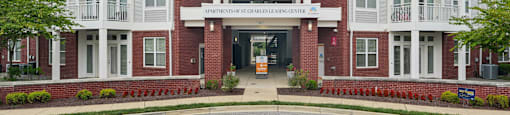 The front of a building with a sign that reads "Apartment of St. Joseph's Center.".