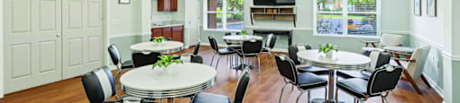 A white room with a table and chairs.