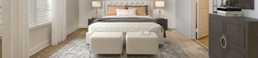 a bedroom with a bed and a ceiling fan at Stone Gate Apartments in NC