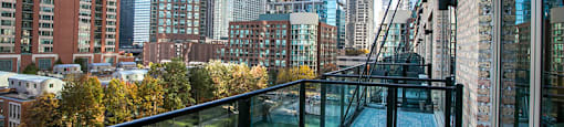 a balcony with a view of the chicago river and skyscrapers