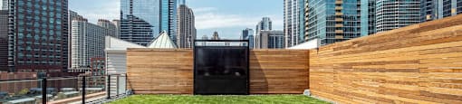 a roof top garden with a view of the city