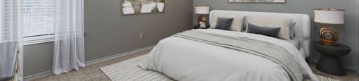 Carpeted bedroom with ceiling fan and window at Towne Centre Village Apartments, Mesquite, Texas