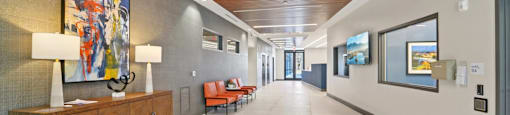 A long hallway with a wooden ceiling and a painting on the wall.