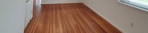 A room with wooden floors and white walls.
